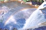 Rainbow Under Waterfall